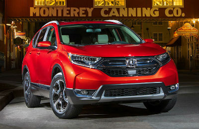 2019 Honda CR-V exterior front fascia and passenger side in front of canning company