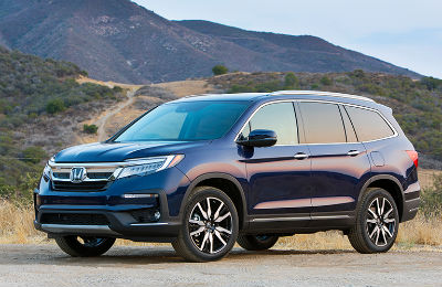 2019 Honda Pilot exterior front fascia and drivers side parked near mountains