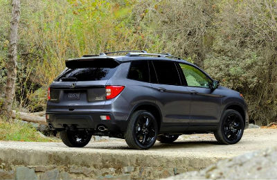 2019 Honda Passport exterior back fascia an passenger side in woods