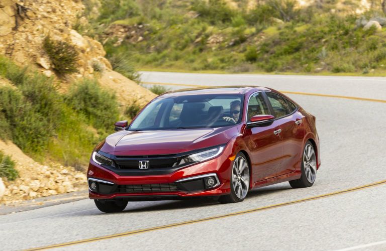 A head-on photo of the 2020 Honda Civic on the road.