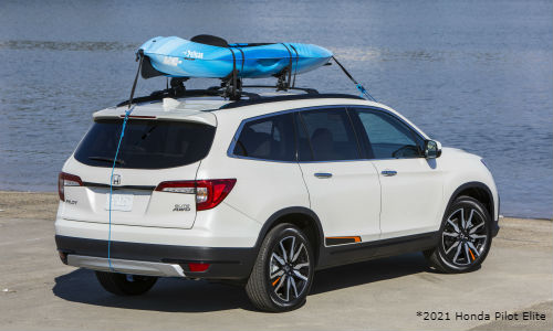 White 2021 Honda Pilot Elite with kayak on roof