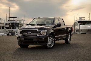 2020 Ford F-150 Limited in front of boats from exterior front drivers side